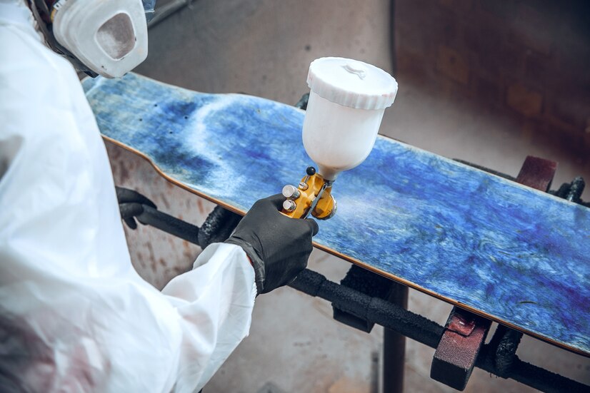 master-painter-factory-industrial-painting-wood-with-spray-gun_155003-18445